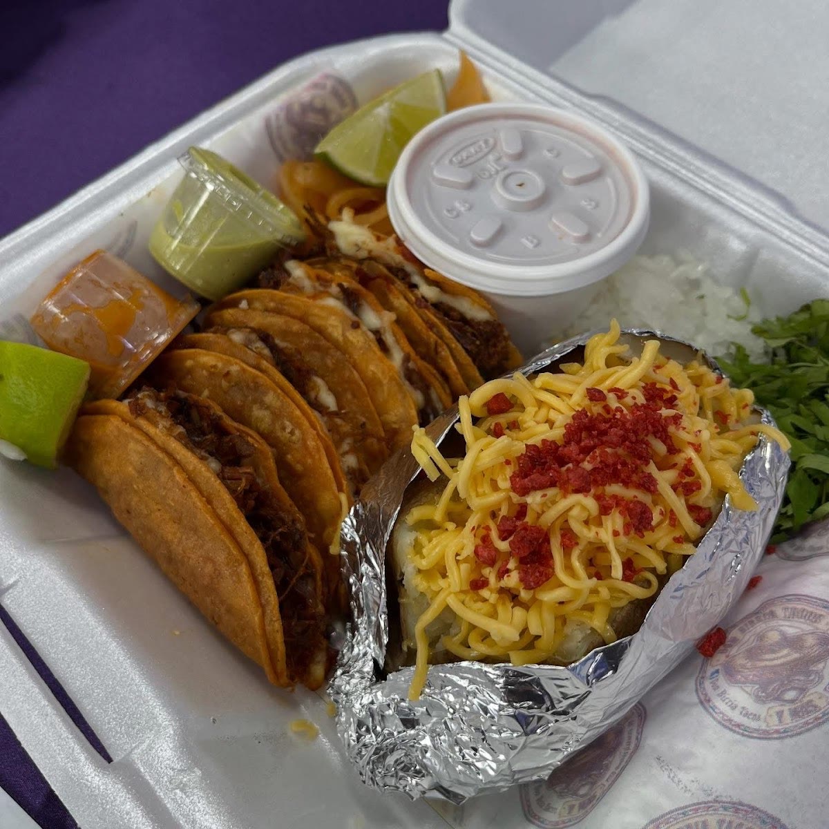 El Combito to go: four birria tacos, a loaded baked potato and consomé