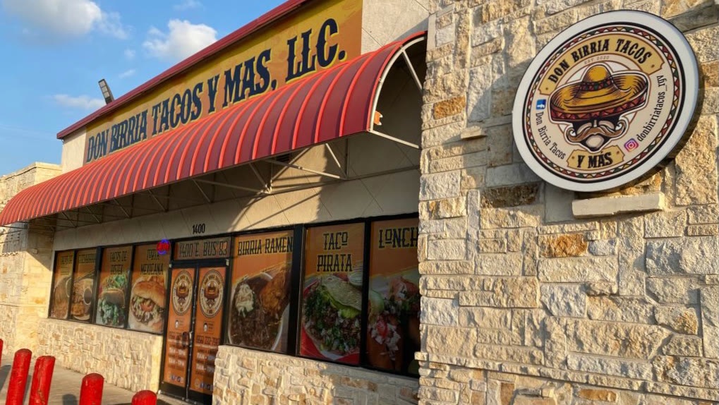The Don Birria storefront: stone walls, a red awning, and the round sombrero sign